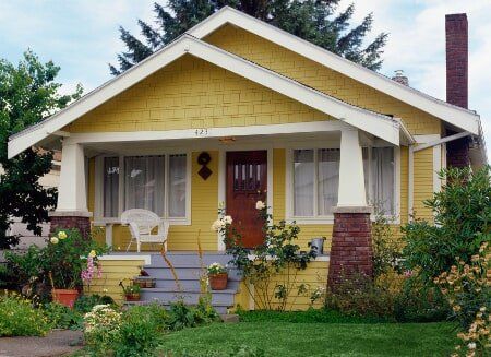 Quaint yellow 1950's home, well painted and landscaped