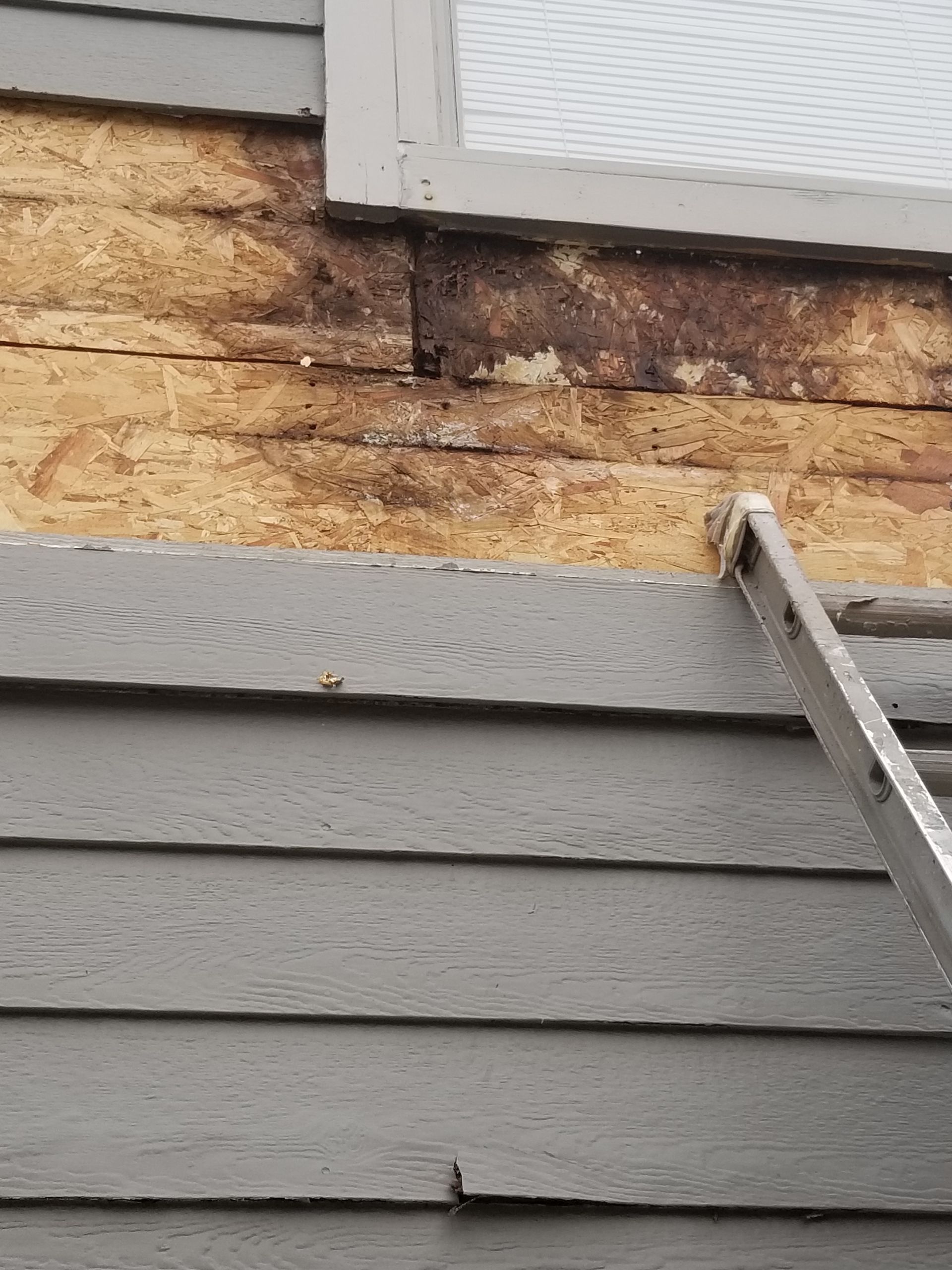 Wood rot company Lap siding needing repair in Shawnee KS by Home Pros Painting of Lenexa KS