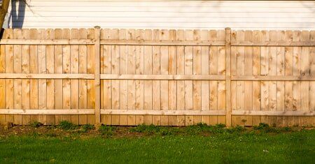 Wood Privacy fence well-maintained, freshly stained in light color