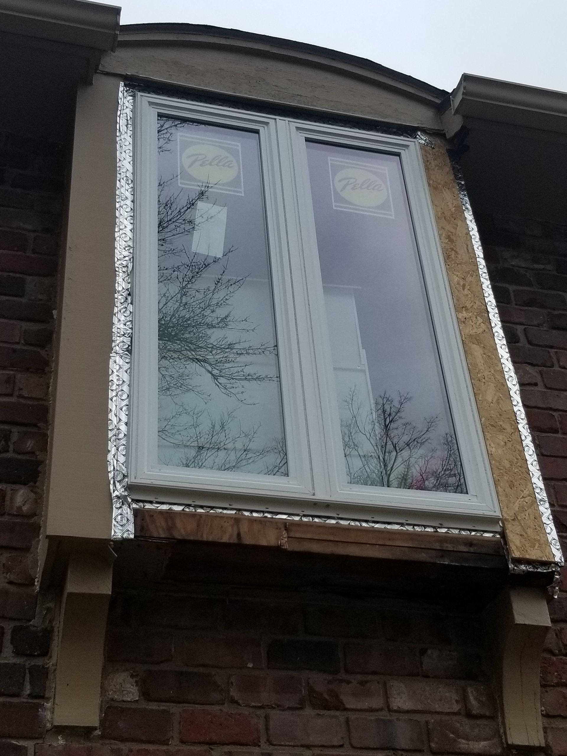 Window trim needing repair in Leawood KS by Home Pros Painting