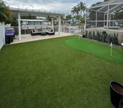 Artificial Turf installation after photo Artificial Turf installation after photo of family enjoying their new, dirt free yard.