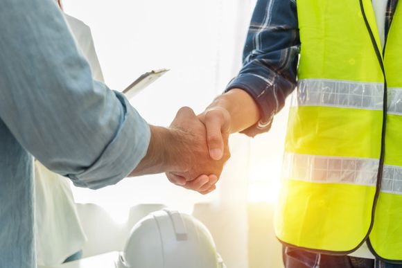 shaking hands with construction man