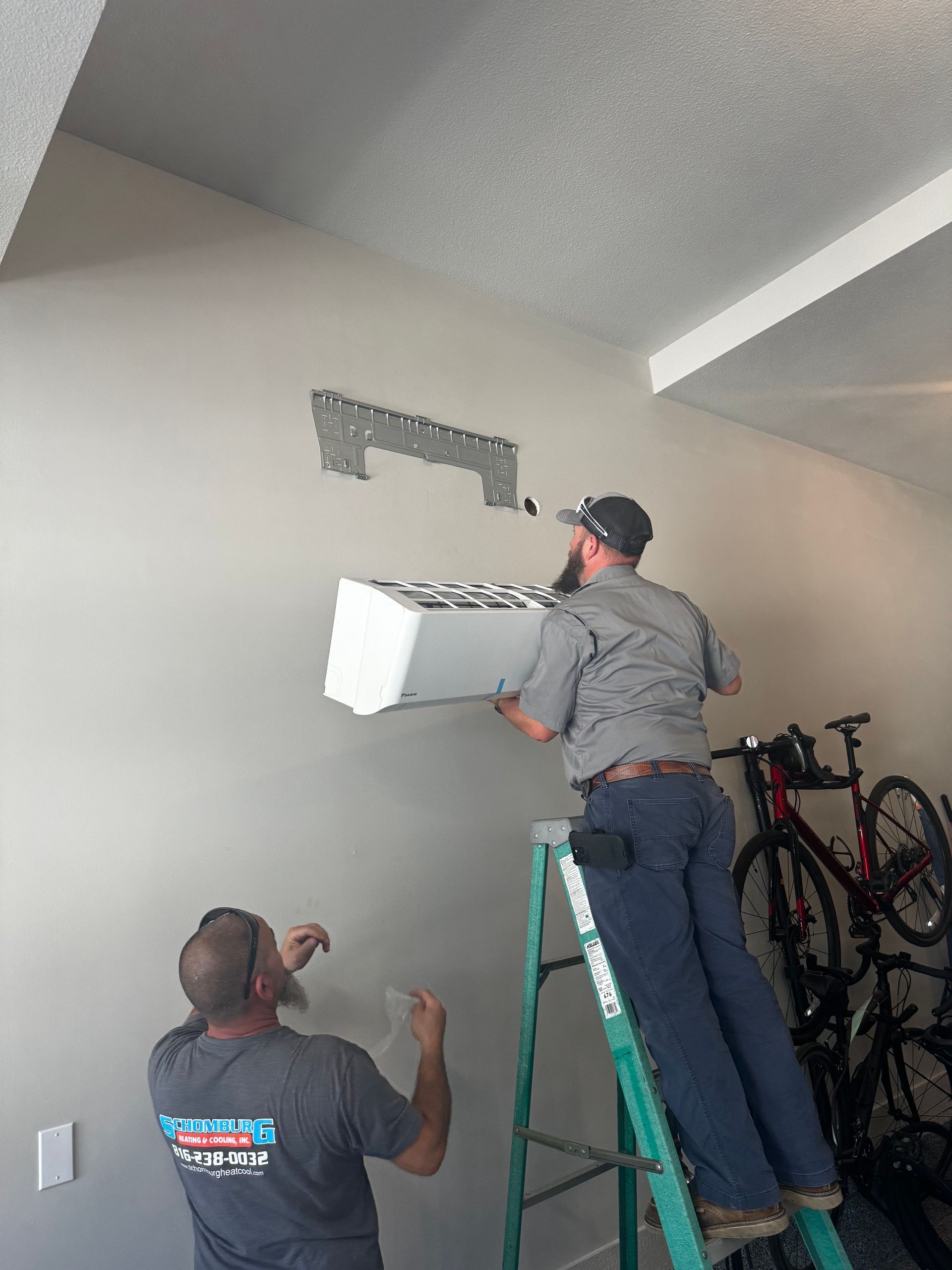 man installing ductless mini split