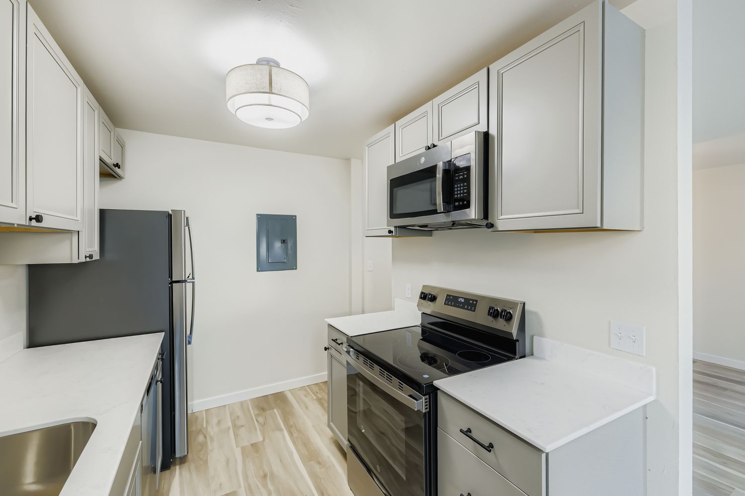 photo of a kitchen, with the living room in the background