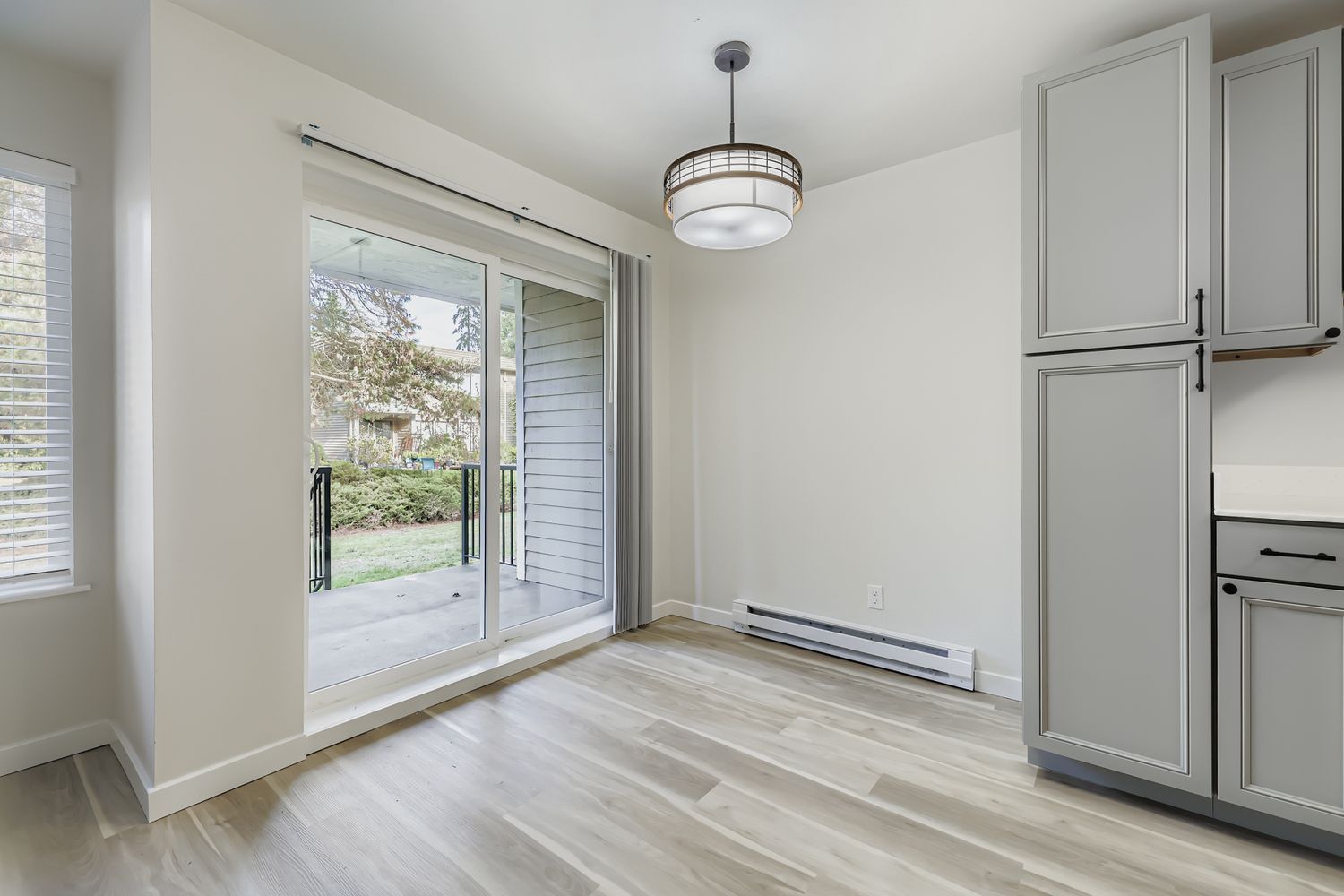 Photo of the dining area showing the porch in the background