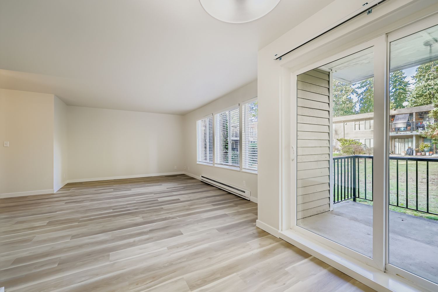 Photo of a large living room, with the porch on the side of the photo
