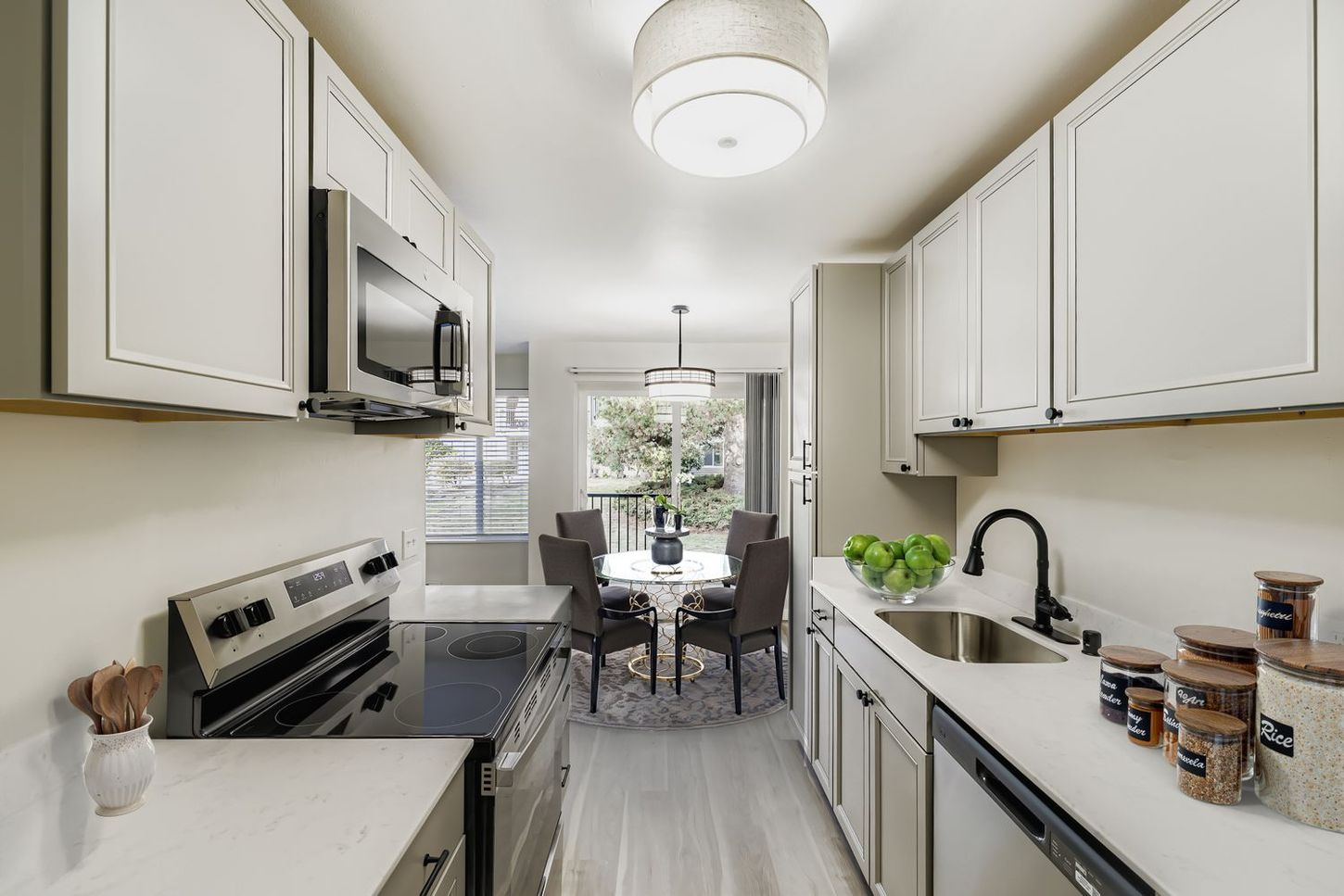 Photo of a kitchen, with the dining area in the background