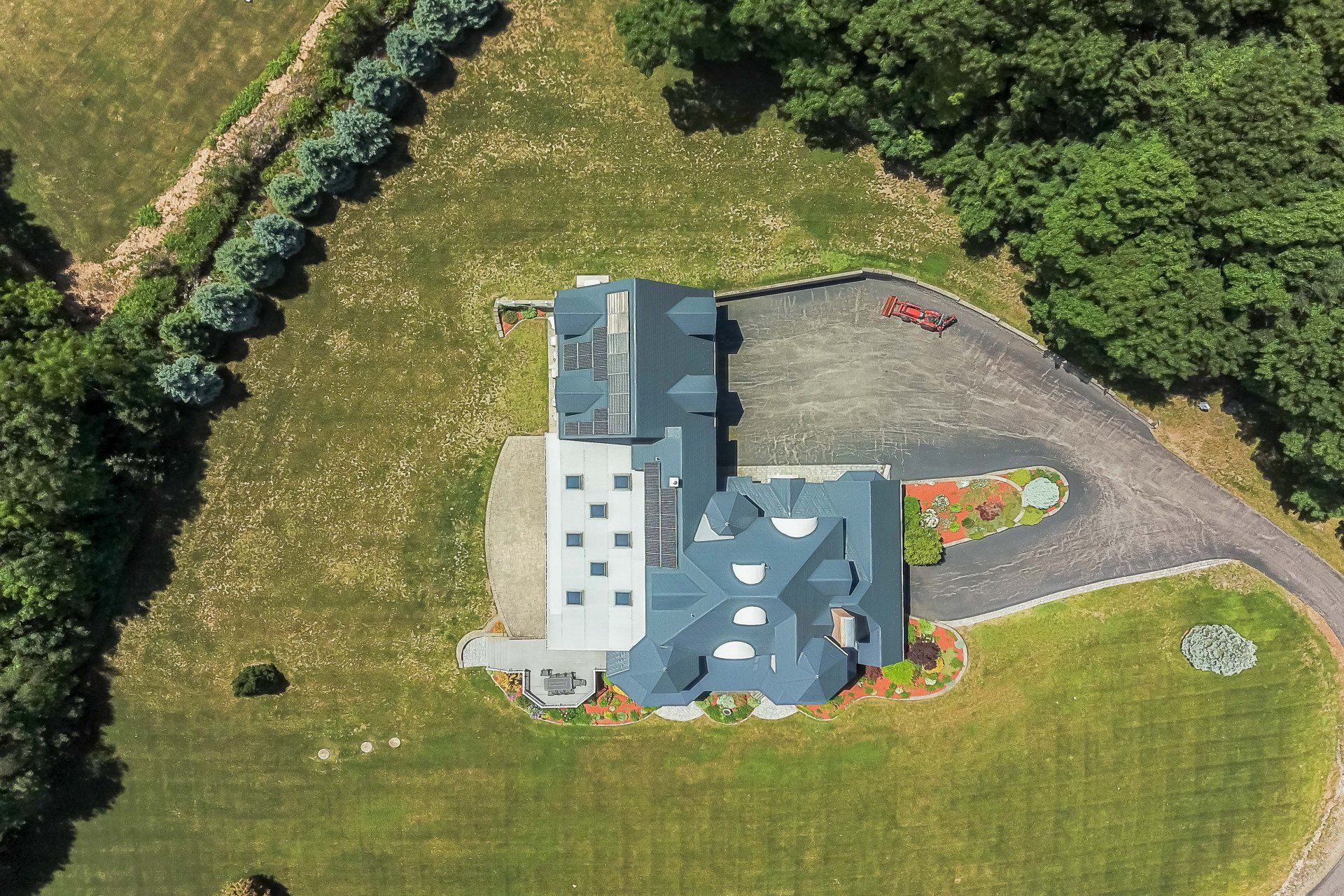 Deep Charcoal Interlock® Metal Slate Roof w/ Solar Panels