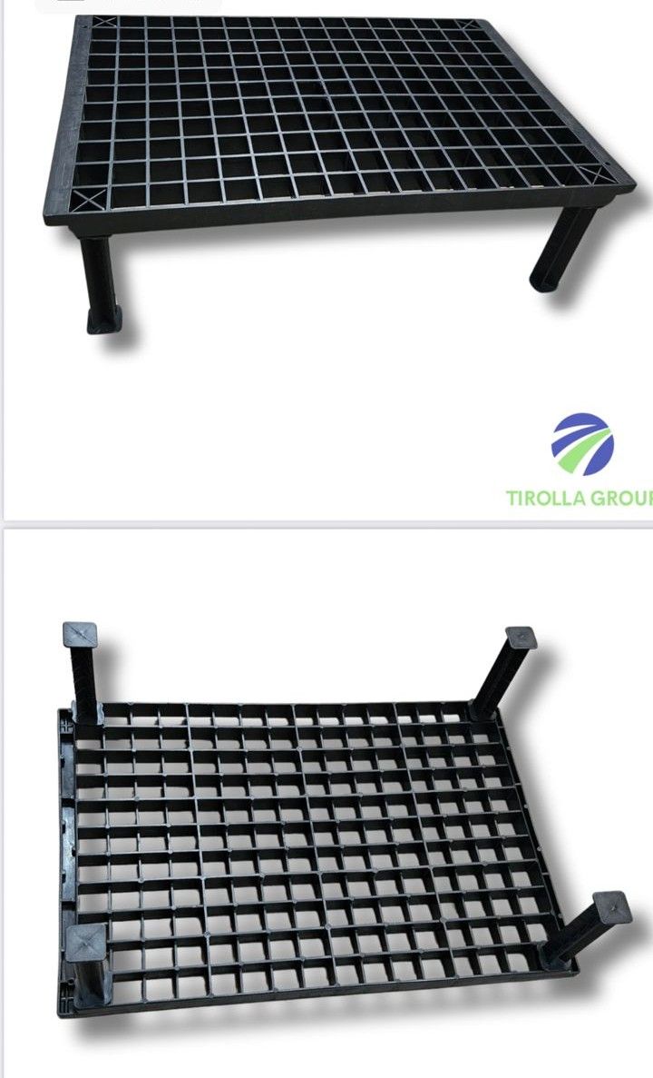 A tray of black plastic cups and a tray of black plastic cups on a white background.
