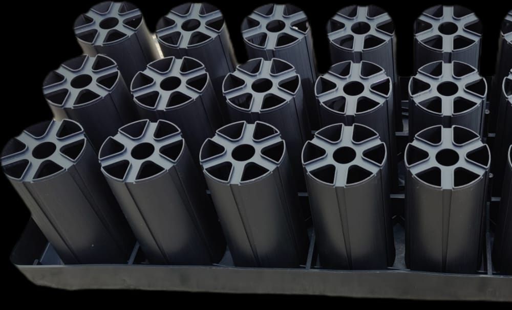 A tray of black plastic cups and a tray of black plastic cups on a white background.