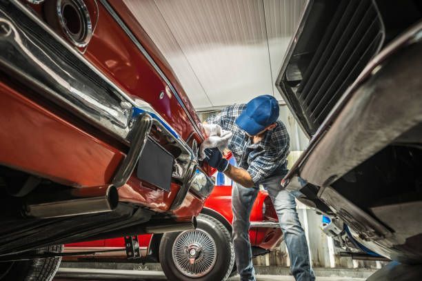 Classic car repair provided by a collector cleaning his vehicle.