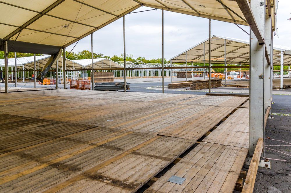 There Is a Wooden Floor Under a Tent — Watto's Earthmoving & Machinery Hire in Atherton, QLD
