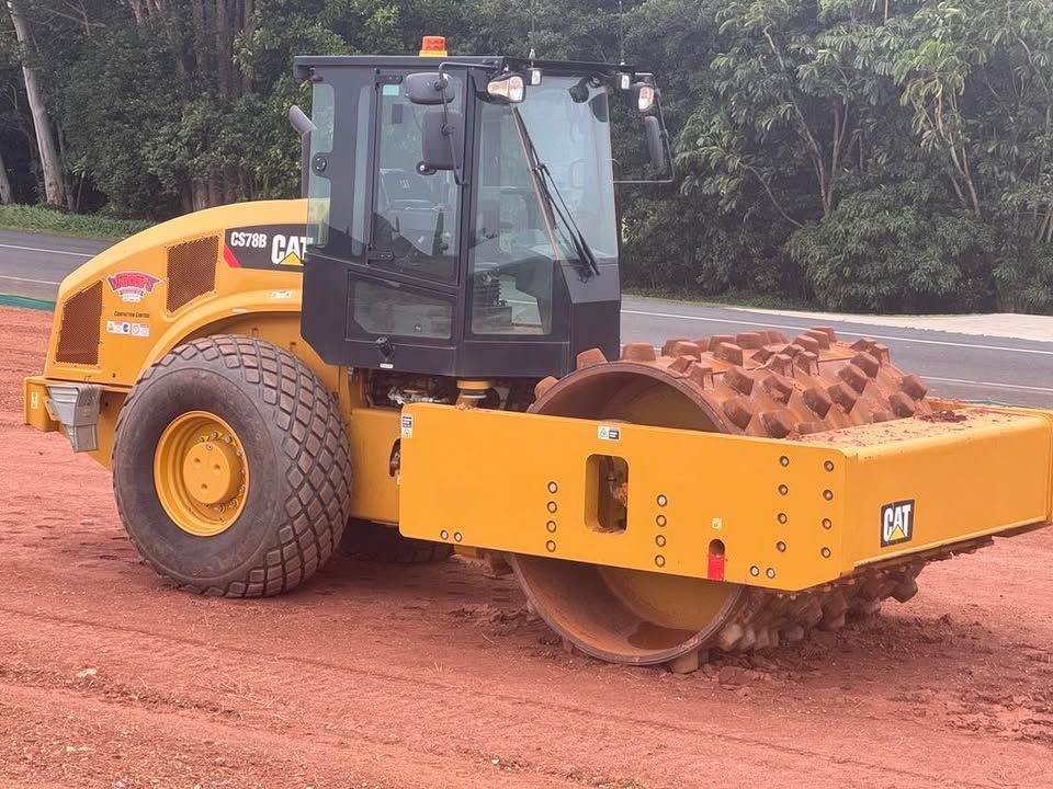 A Couple of Construction Workers Standing on Top of A Scaffolding — Watto's Earthmoving & Machinery Hire in Mareeba, QLD