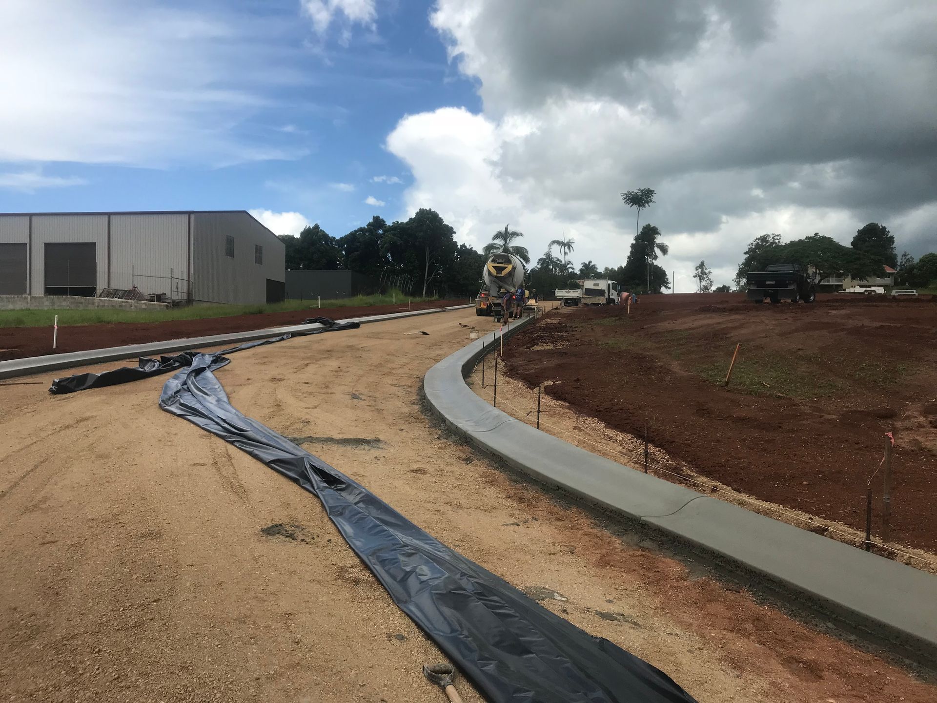 A Residential Neighbourhood With Trees And Road In Front — Watto's Earthmoving & Machinery Hire in Atherton, QLD