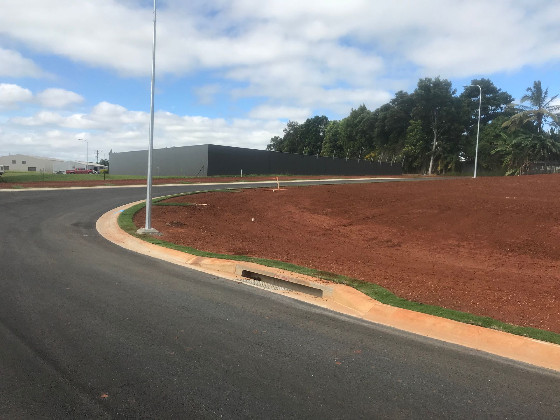 An Aerial View of A Residential Neighborhood at Sunset — Watto's Earthmoving & Machinery Hire in Mareeba, QLD