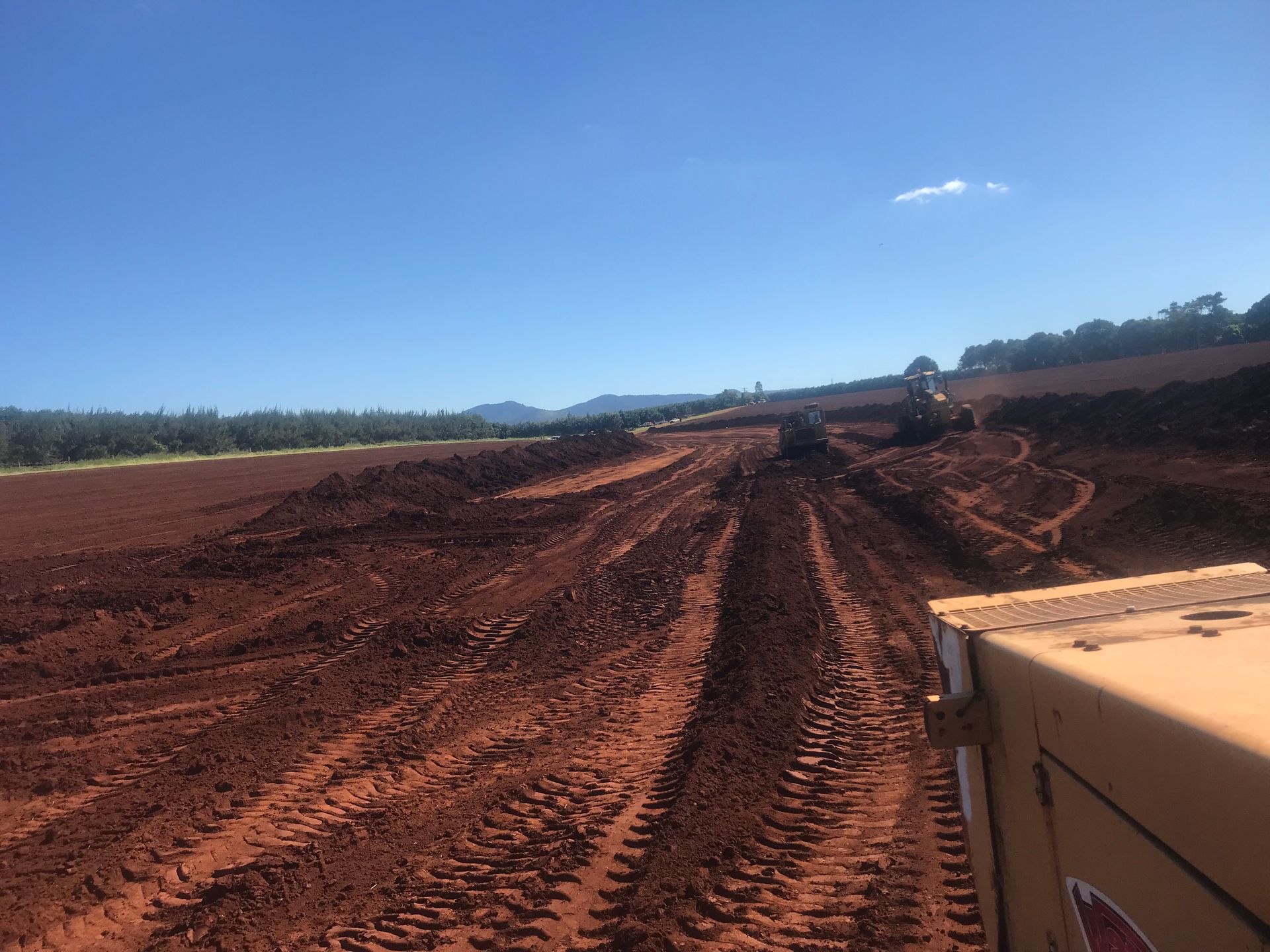 An Aerial View of A Construction Site with Trucks and Tractors — Watto's Earthmoving & Machinery Hire in Atherton, QLD