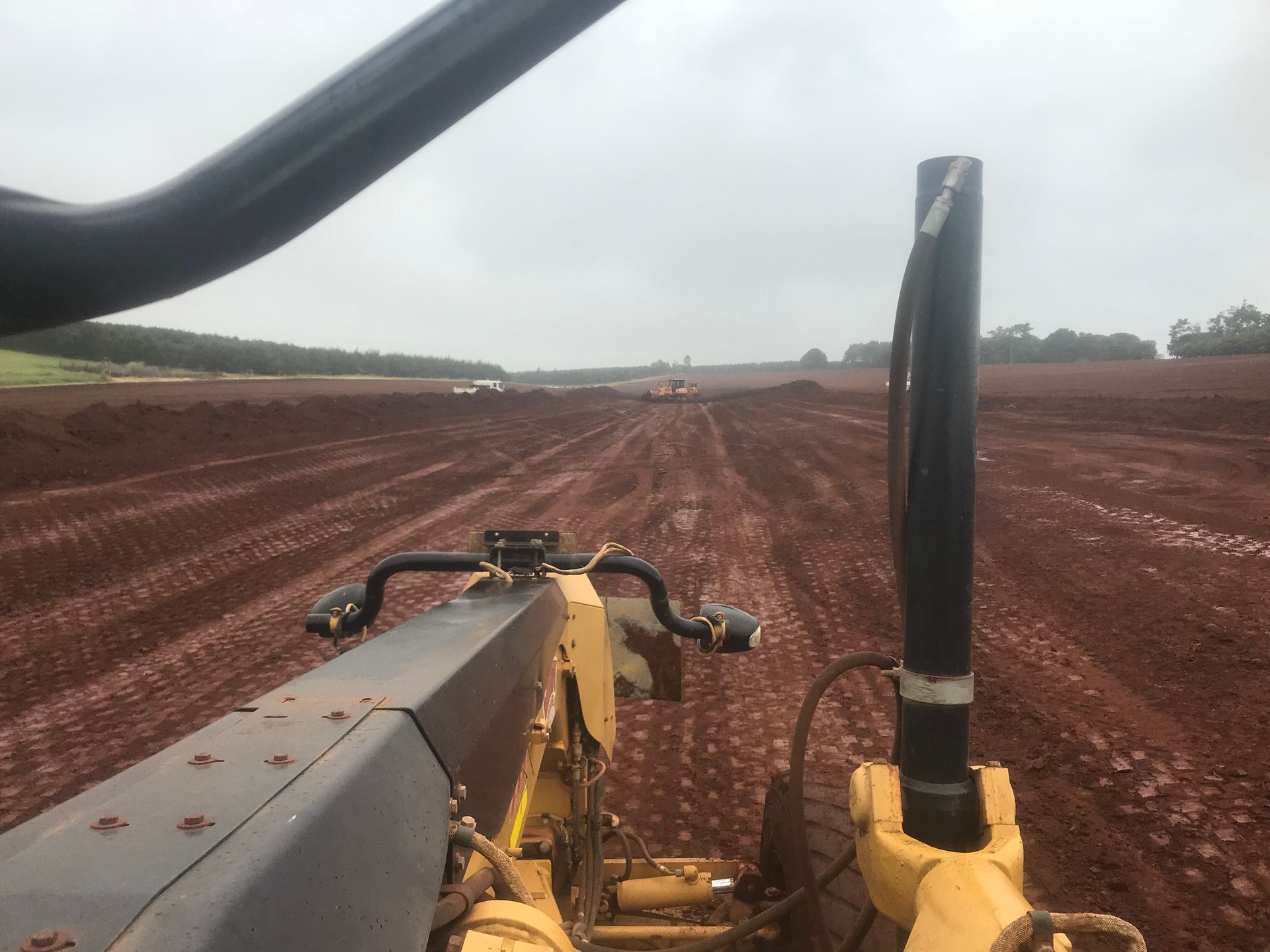 An Aerial View of A Construction Site with A Yellow Bulldozer — Watto's Earthmoving & Machinery Hire in Atherton, QLD