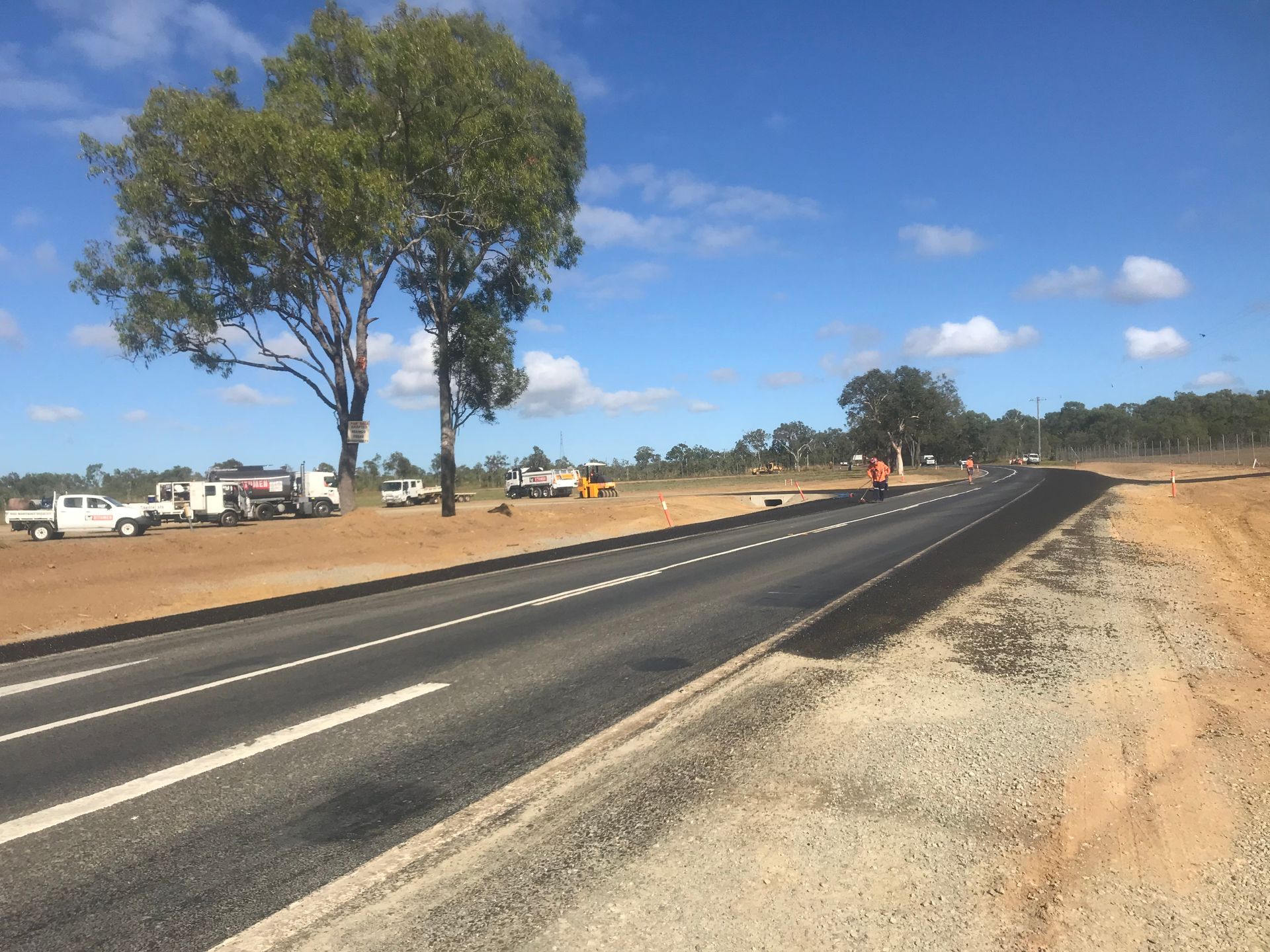 A Group of Construction Workers Are Working on A Pipeline — Watto's Earthmoving & Machinery Hire in Atherton, QLD