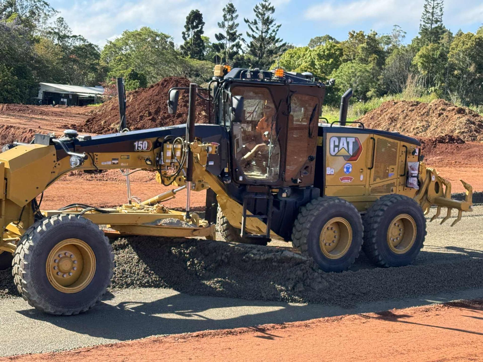 A Vacuum Truck Is Driving Down a Highway Next to A Van — Watto's Earthmoving & Machinery Hire in Atherton, QLD