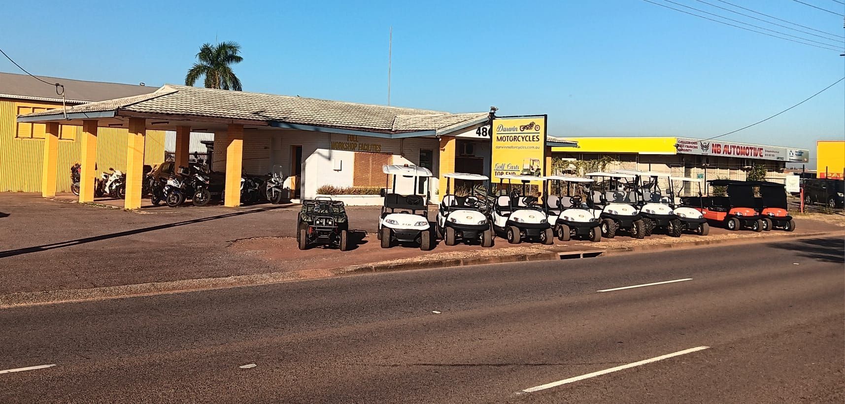 A Row of Golf Carts Are Parked Next to Each Other — Golf Carts Top End in Zuccoli, NT