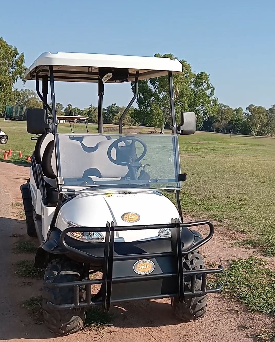 A Golf Cart With Beige Seats and a Steering Wheel — Golf Carts Top End in Palmerston, NT