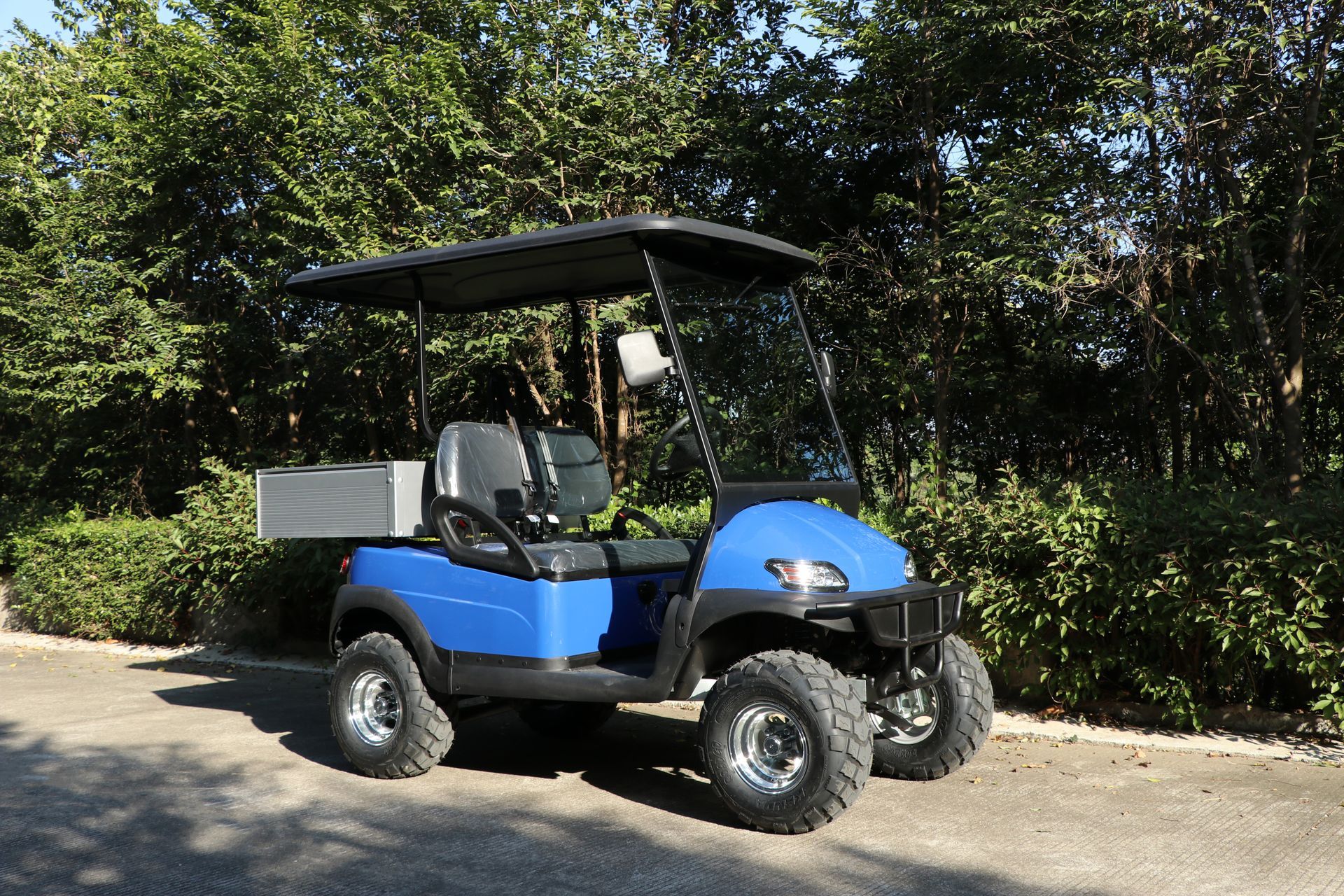 A Golf Cart is Parked on the Concrete on a Golf Course — Golf Carts Top End in Zuccoli, NT 