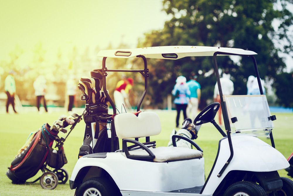 Men Around a Golf Cart