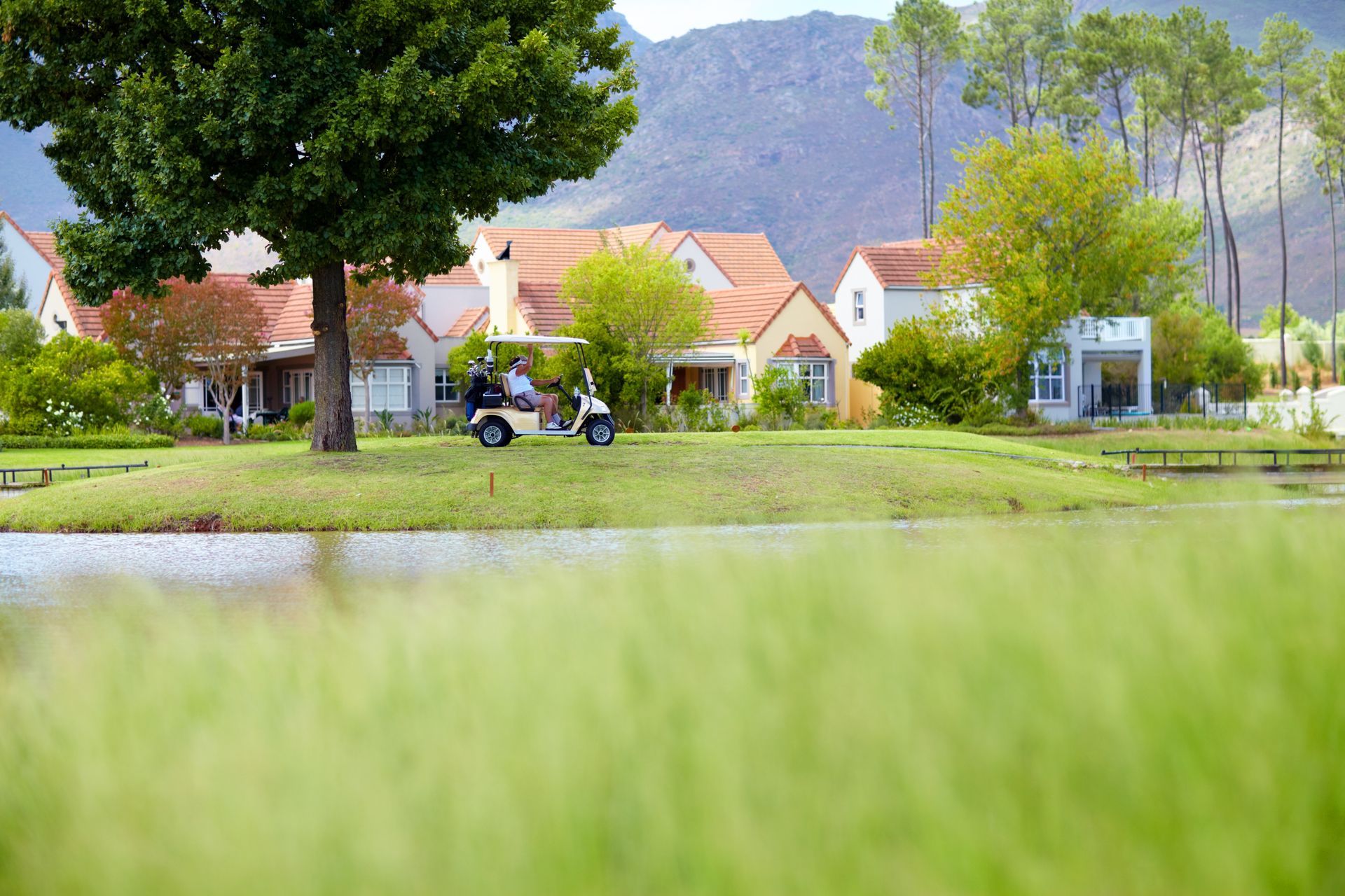 A Man is Driving a Golf Cart on an Open Field — Golf Carts Top End in Zuccoli, NT