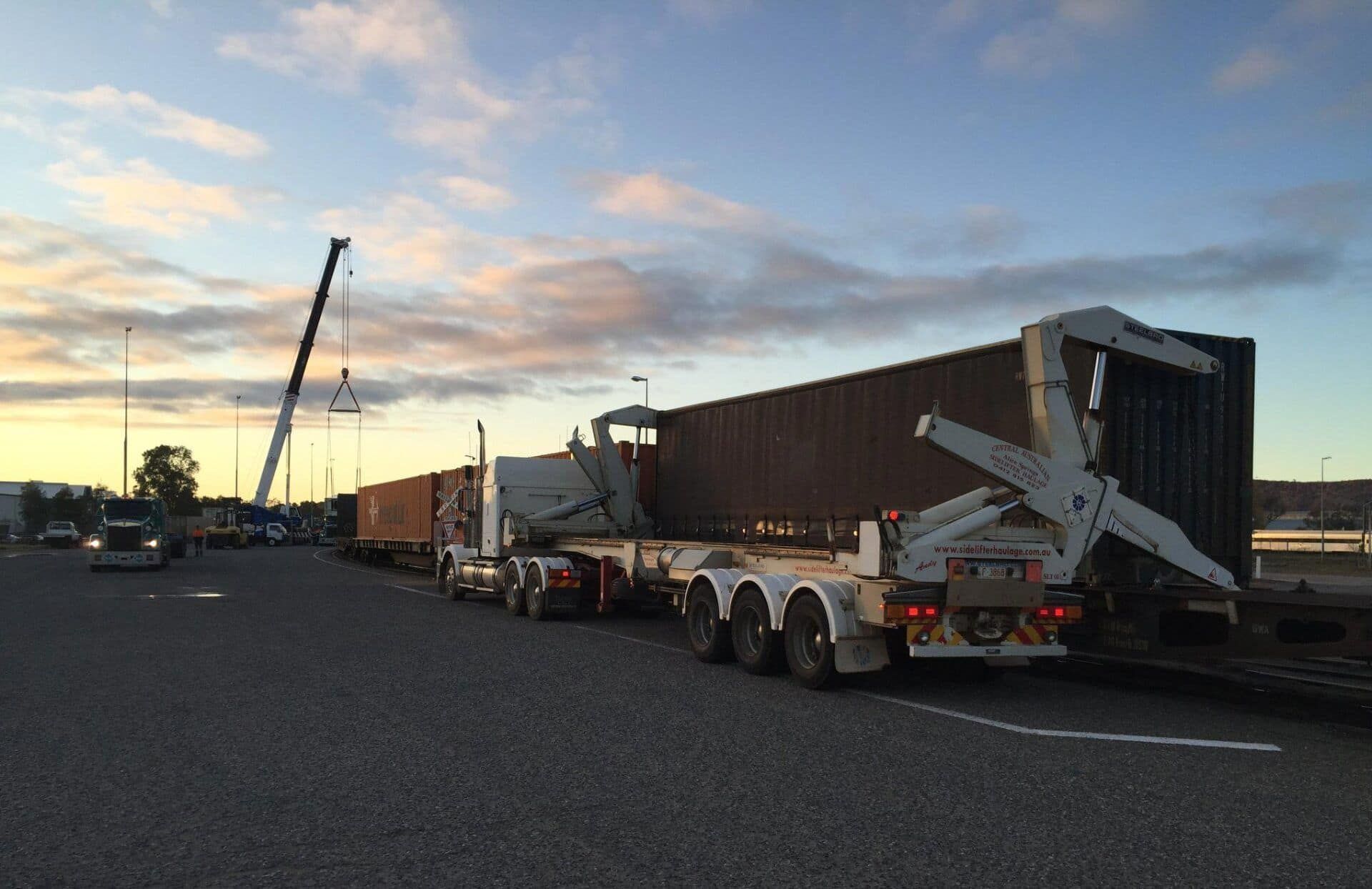 A Row of Semi Trucks Are Parked in A Parking Lot — Spinifex Container Solutions In Ciccone, NT
