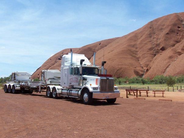 A Semi Truck Is Parked in Front of A Mountain — Spinifex Container Solutions In Ciccone, NT