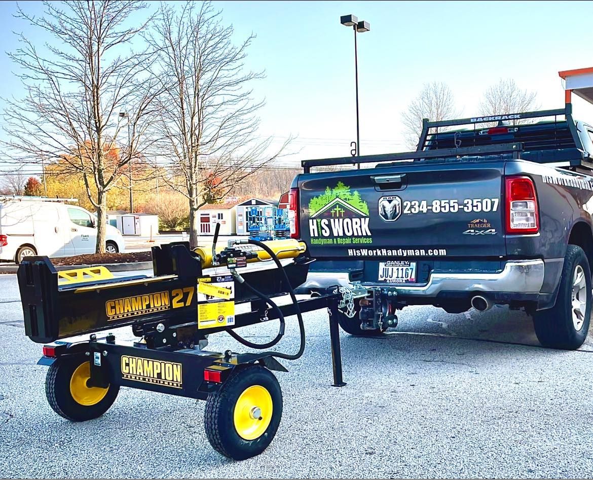 A truck with a log splitter attached to it