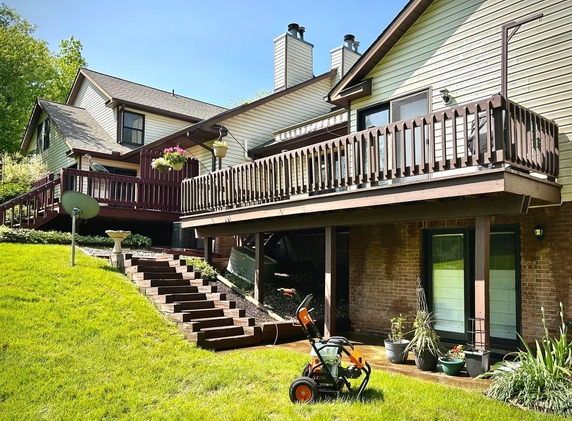 A house with a large deck and stairs leading up to it