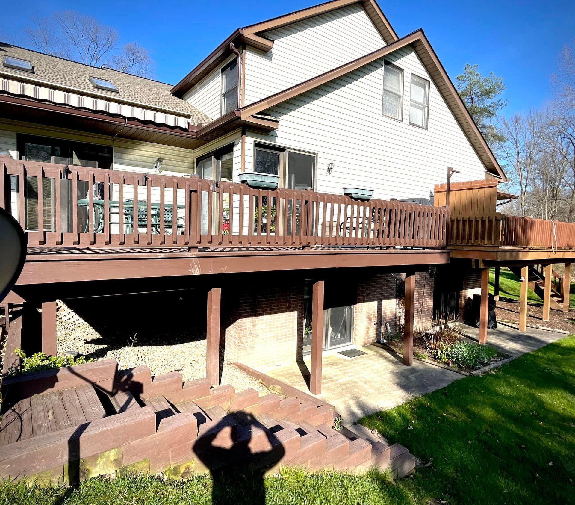 A large house with a large deck in front of it