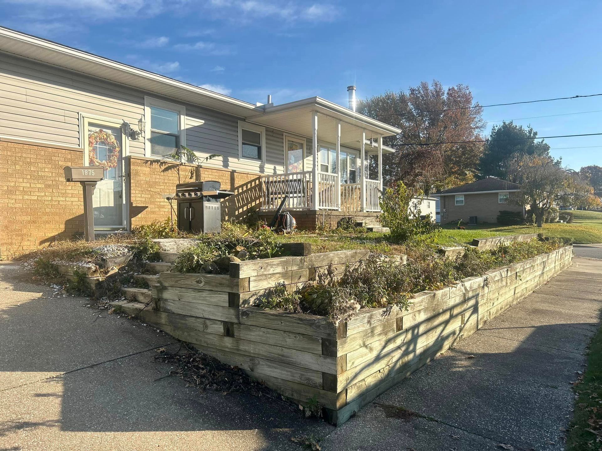 A house with a wooden fence in front of it.