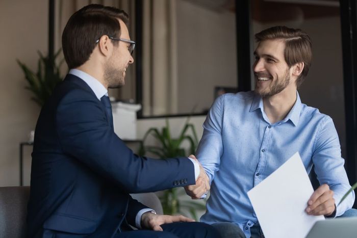 HR Staff and Client Shaking Hands