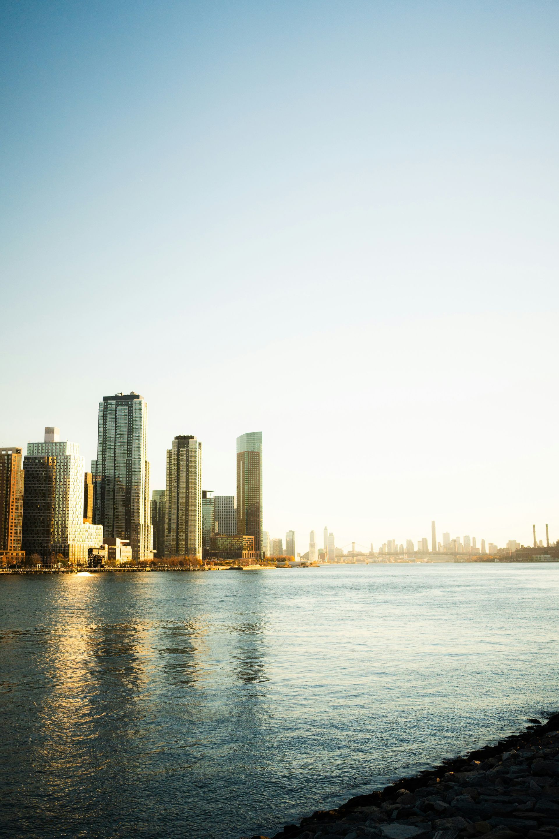 Tennessee Theatre sign on a tall brick building in a downtown street setting, flags, blue sky.