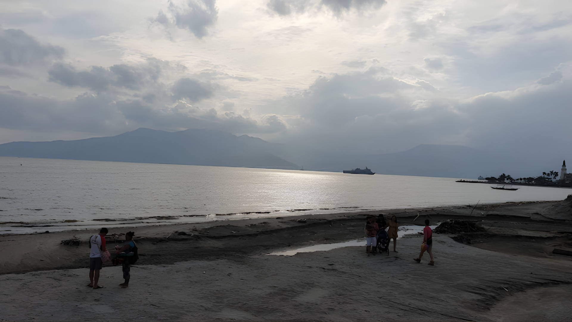 Visitors strolling along the coastal boardwalk at Subic Bay near The Aurora Subic Hotel