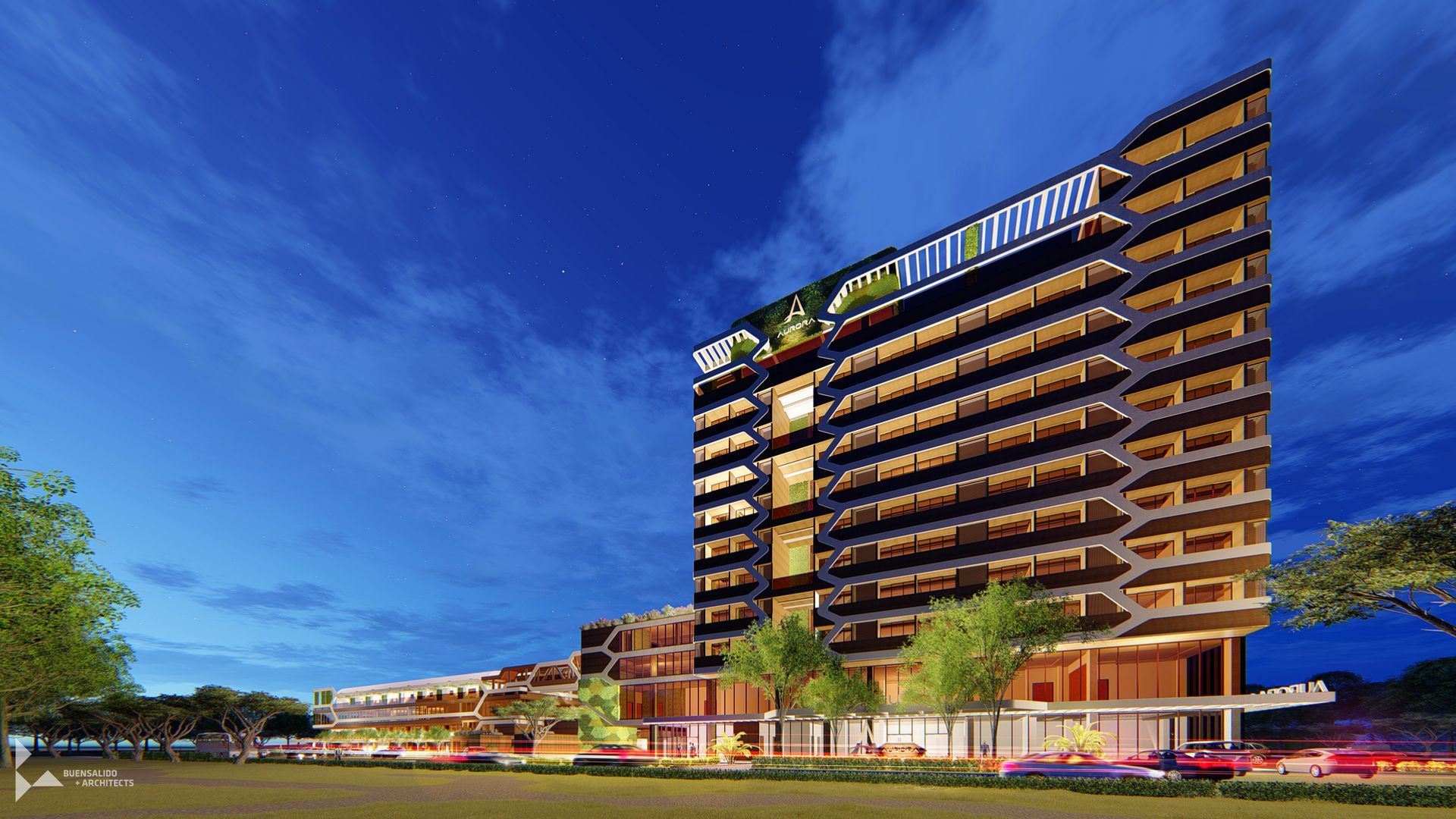 Aurora Subic Hotel building with a lot of windows is lit up at night.