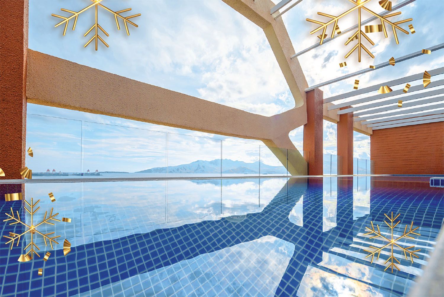 Indoor pool with a glass wall and a view of a mountain range. Gold snowflake decorations.