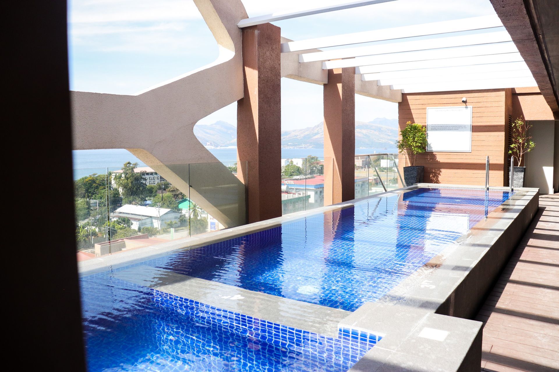 Aurora Subic Hotel with large swimming pool and a view of the ocean