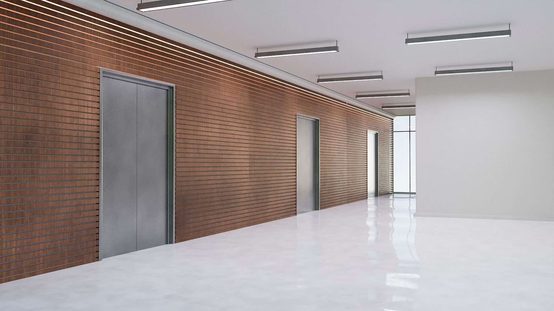 An empty hallway with a brick wall and a white floor.