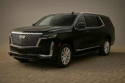 Black Cadillac Escalade SUV, studio shot.