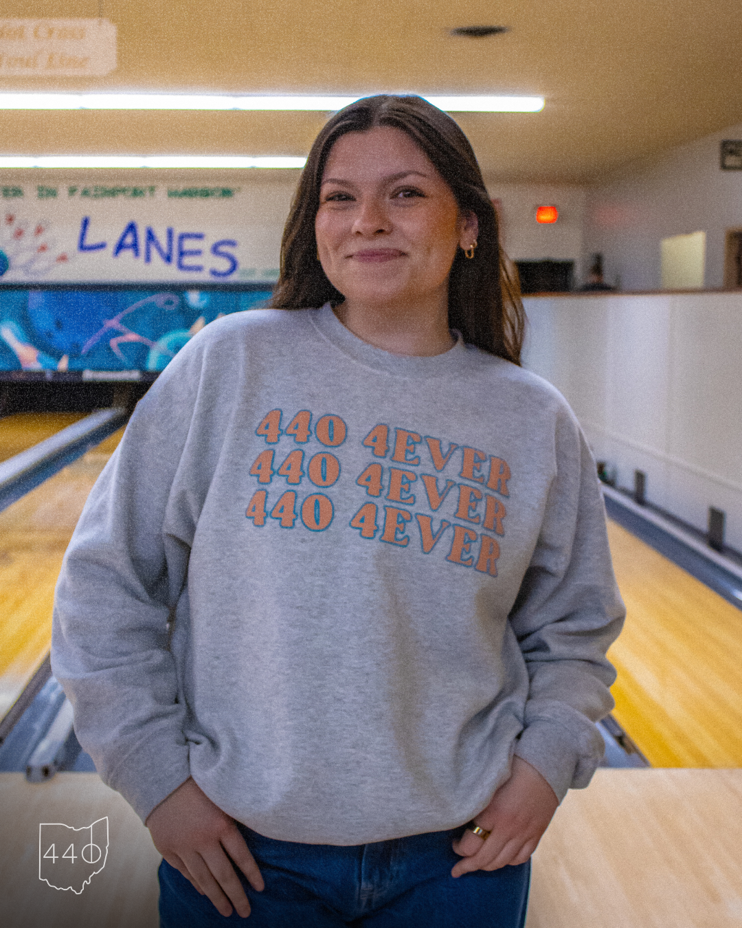 Woman in a gray sweatshirt with 