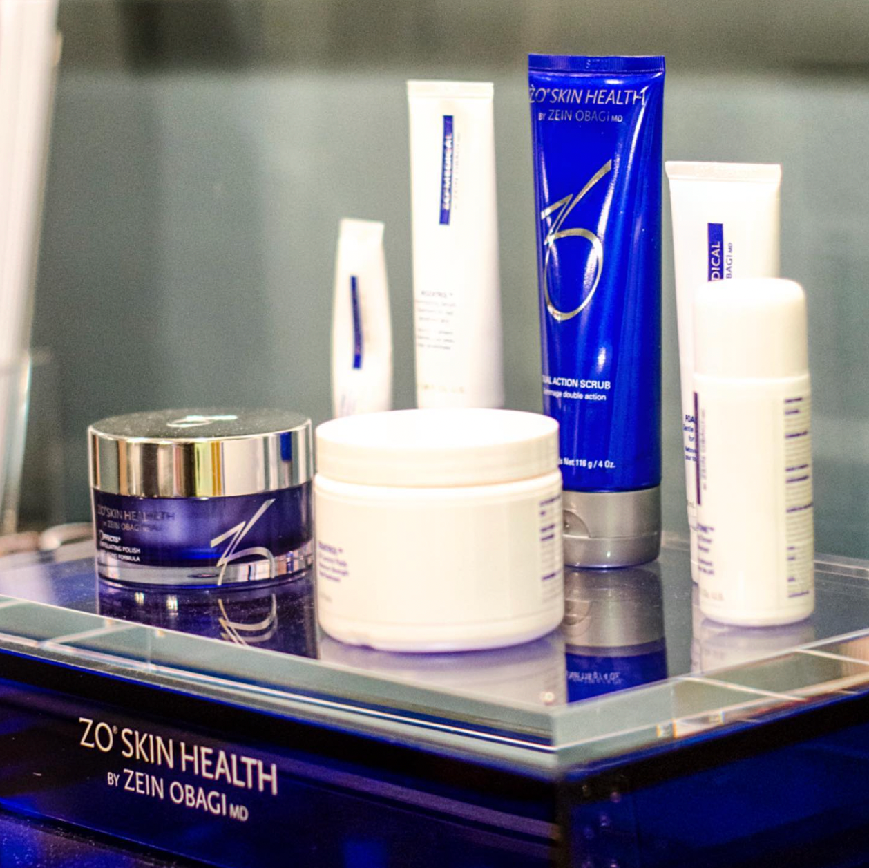 Cosmetic products from ZO Skin Health in blue and white on display.