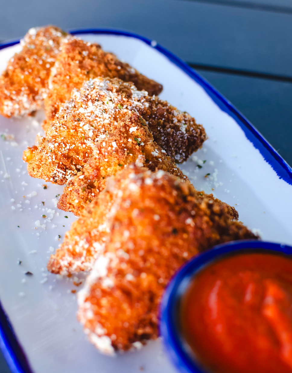 Fried ravioli dusted with parmesan, served with marinara sauce.
