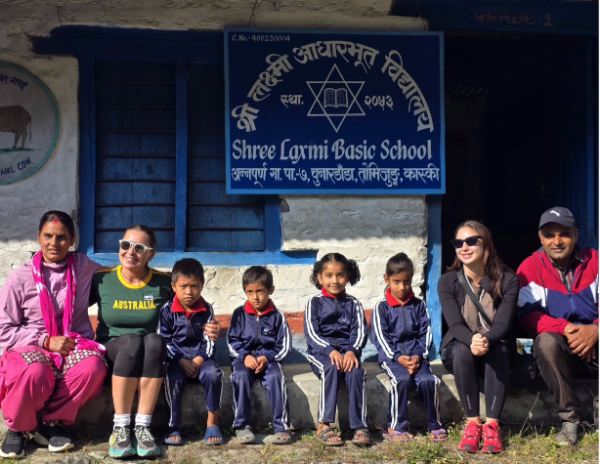 Group of people posing in front of 