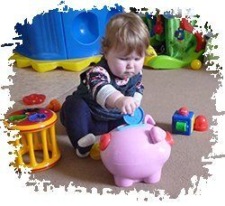 Baby and piggy bank in a childcare