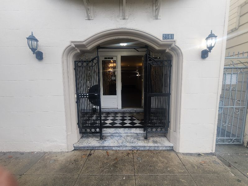 A white building with a black and white checkered floor