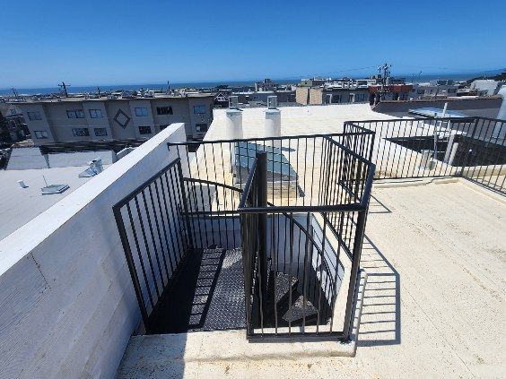 A spiral staircase on the roof of a building