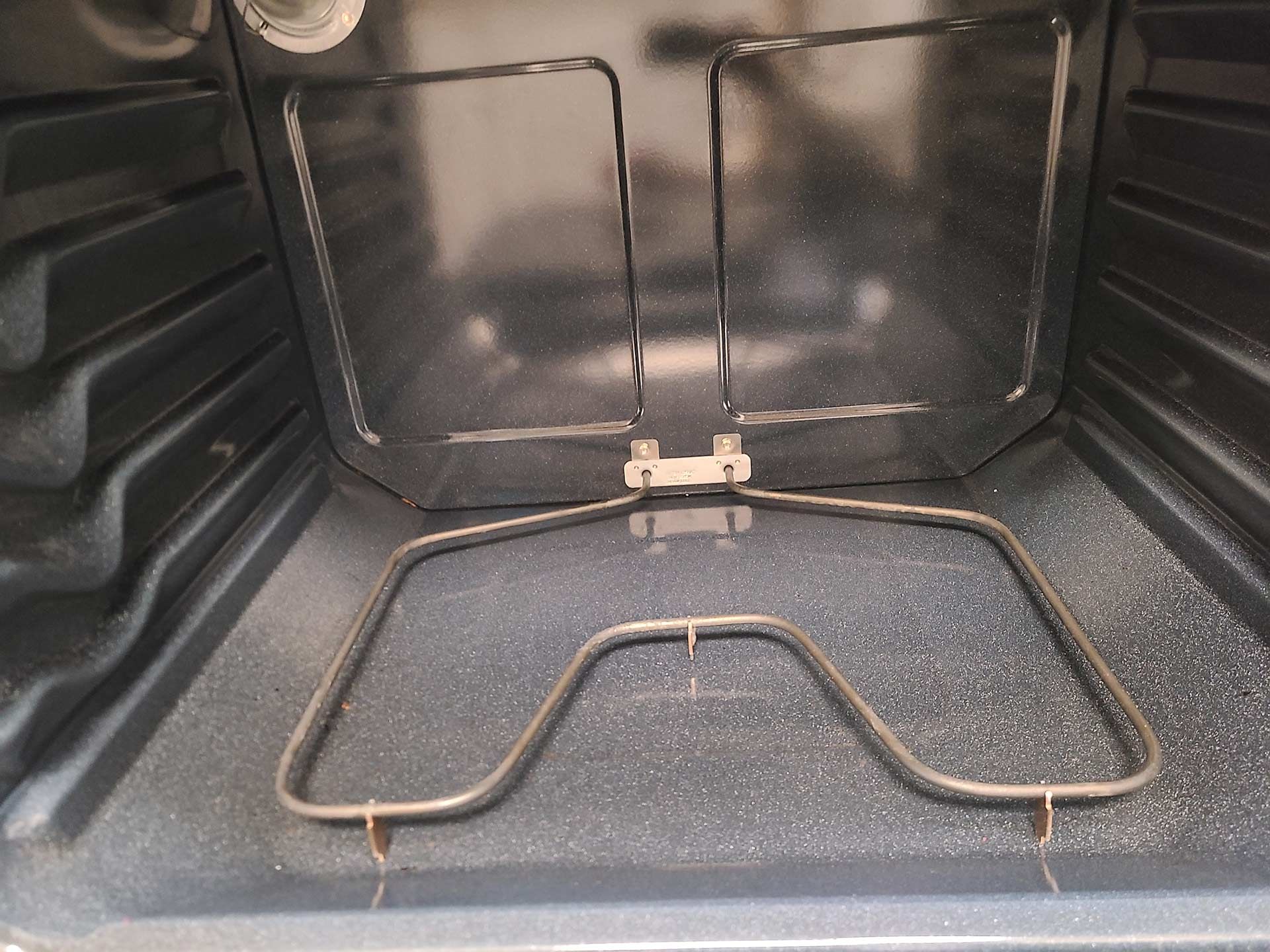 Interior of a Clean Oven with a Heating Element at the Bottom